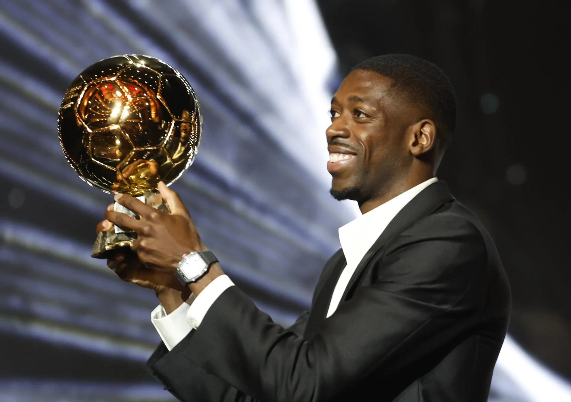 Paris Saint-Germain's player Ousmane Dembele poses with the Men's Ballon d'Or trophy during the Ballon d'Or 2025 ceremony at the Theatre du Chatelet in Paris, France, 22 September 2025. EFE/EPA/Mohammed Badra