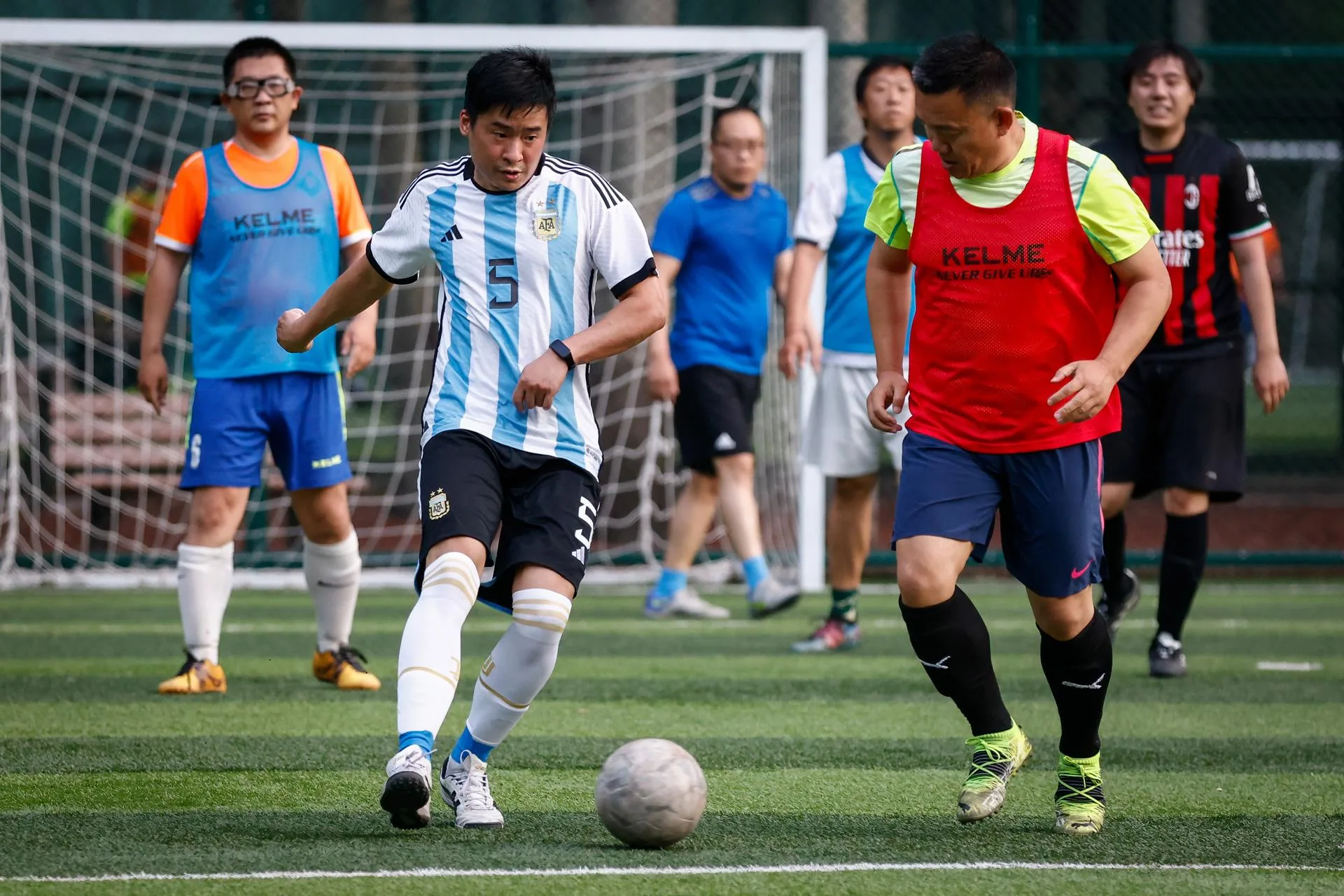 [FILE] A Chinese player wearing an Argentina jersey plays football at a park in Beijing, China, 07 June 2023. EFE-EPA/MARK R. CRISTINO