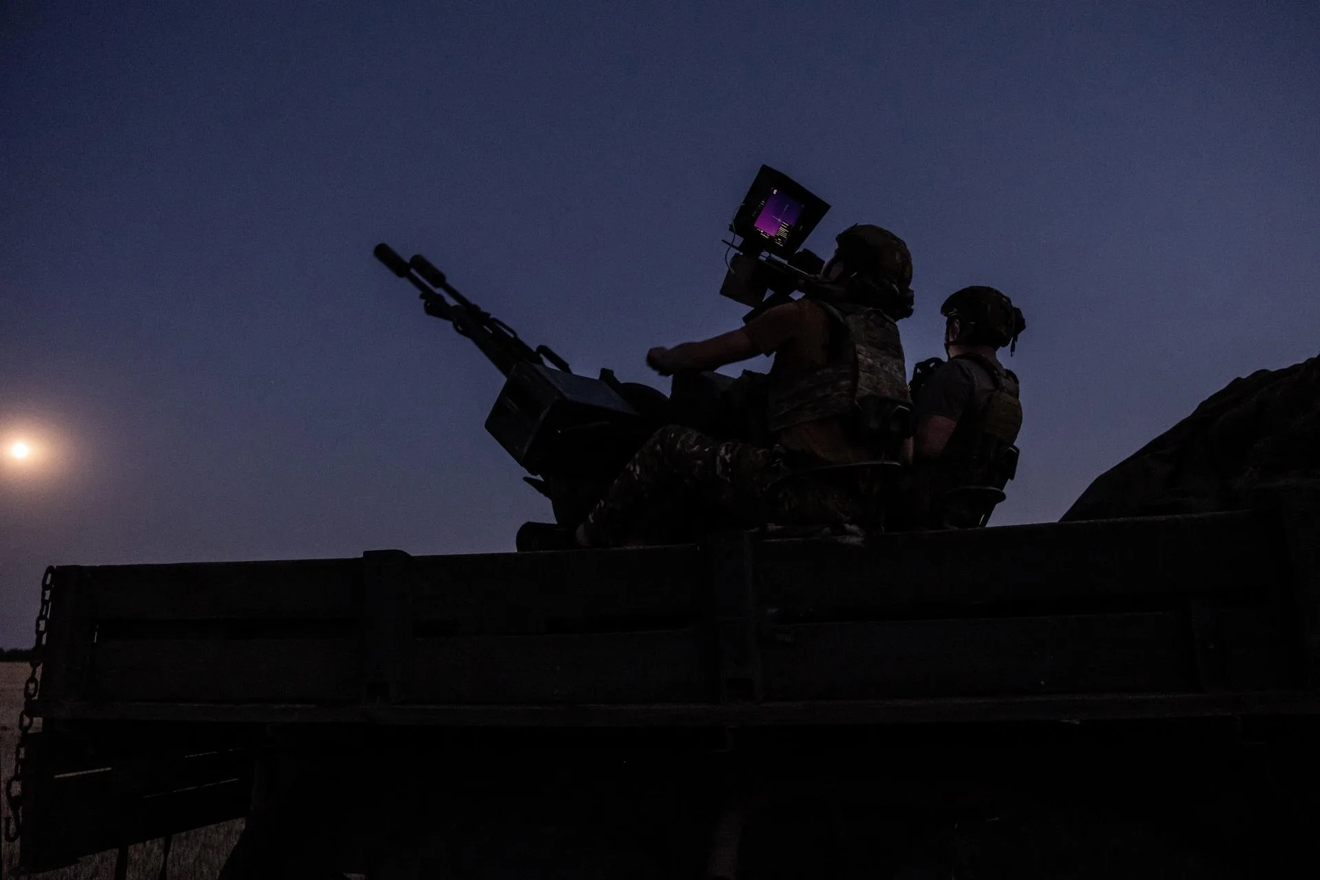 (FILE). Two soldiers from a Ukrainian Army anti-aircraft artillery brigade scan their sector for Shahed drones on Ukraine's southern frontline on the night Russia launched the largest combined airstrike since it began its full-scale invasion of Ukraine. July 08, 2025. EFE/EPA/Maria Senovilla
