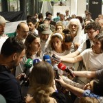 An activist speaks upon the arrival at Barajas Airport in Madrid of another group of Spaniards who were part of the Global Sumud Flotilla, on an A-400 aircraft of the Spanish Air Force. EFE/Juanjo Martín