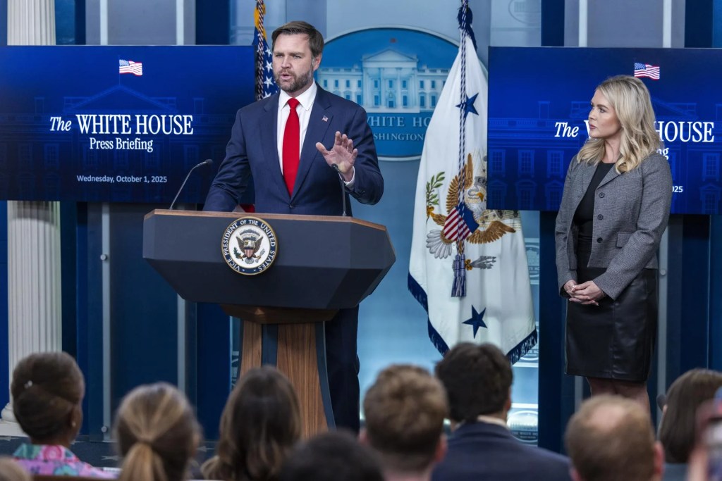 US Vice President JD Vance (L), with White House Press Secretary Karoline Leavitt, responds to a question from the news media during an appearance at the White House Daily Briefing at the White House in Washington, DC, US. October 01, 2025. EFE/EPA/SHAWN THEW
